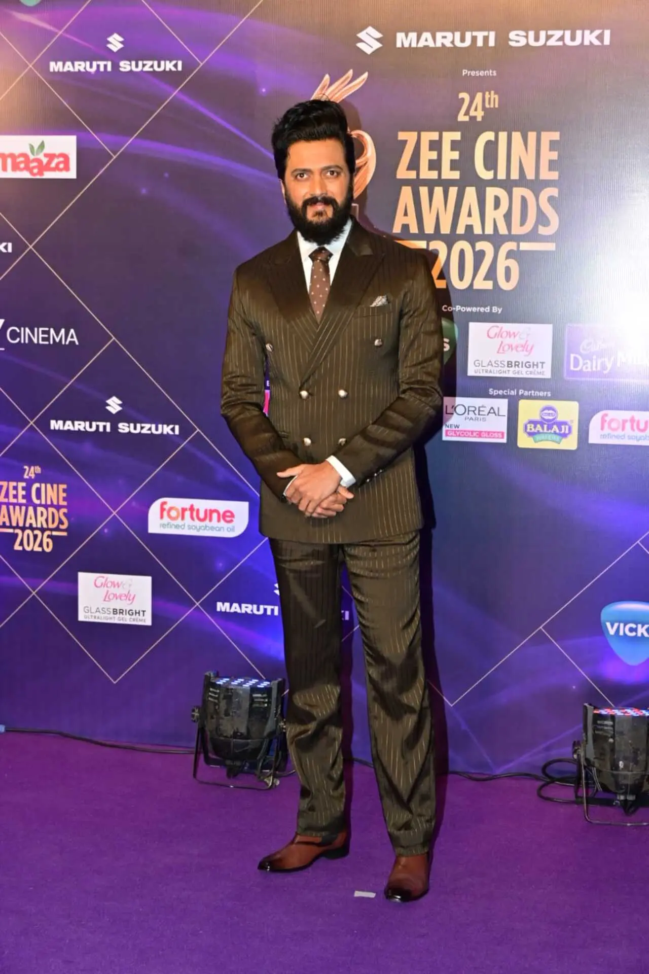 Riteish Deshmukh was seen attending an event in the city in a brown double-breasted suit.
